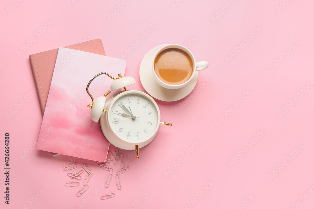 Composition with alarm clock and cup of coffee on color background Composition with alarm clock and cup of coffee on color background