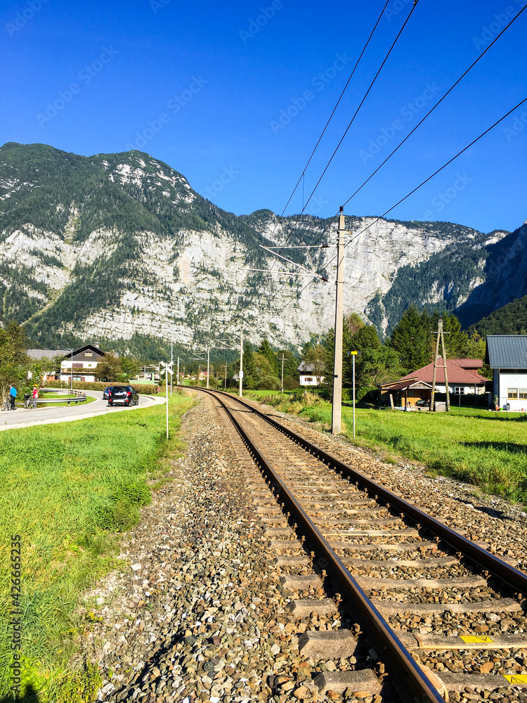 railroad tracks leading to mountain