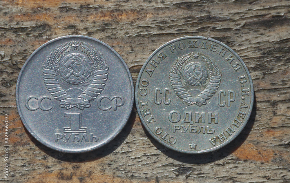 two soviet iron rubles on a wooden background