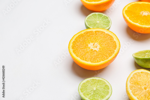 Fototapeta Naklejka Na Ścianę i Meble -  Fresh citrus fruits on light background
