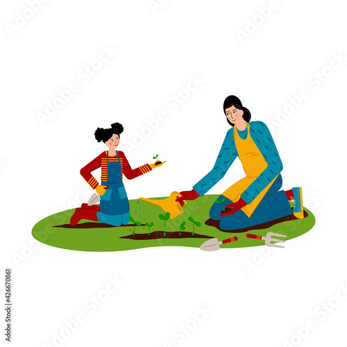 Mum and daughter are working in the garden. Girl is planting seedlings, young woman is watering plants. Concept motherhood child-rearing. Family gardening.