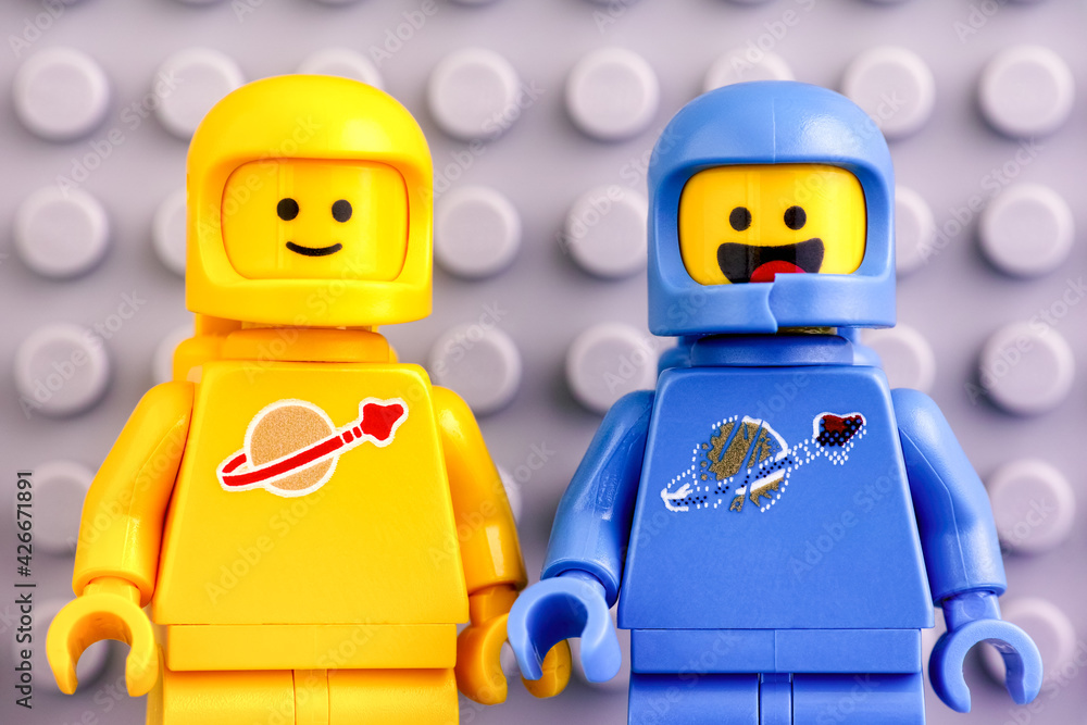 Tambov Russian Federation June 04 2020 Two The LEGO Movie 2 astronaut minifigures Benny and Kenny against gray baseplate background. Stock Photo Adobe Stock