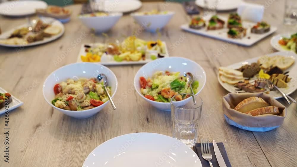 serving the table with appetizers and salads for the holiday. serving the table with appetizers and salads for the holiday.