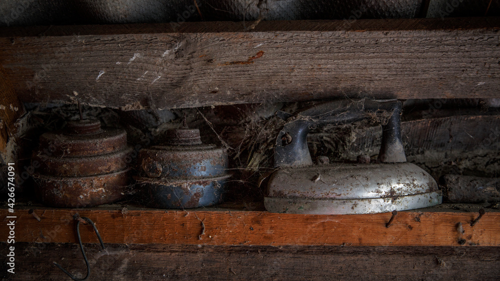 Closeup of an old iron with cobweb in house