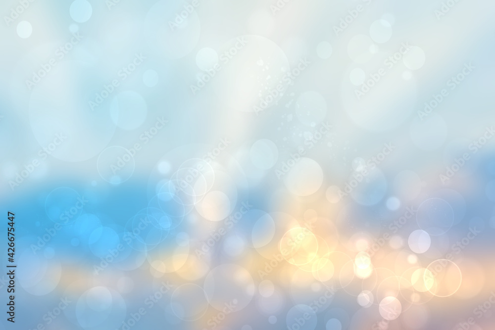 Abstract gradient of light blue yellow pastel background texture with glowing circular bokeh lights. Beautiful colorful spring or summer backdrop.