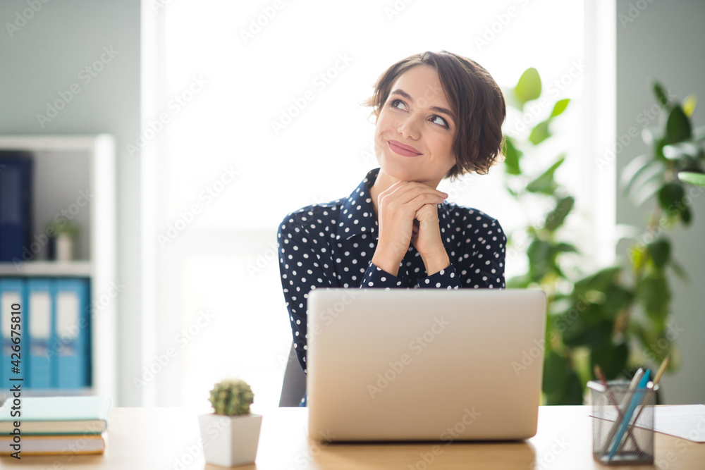 Photo portrait of dreamy female worker sitting in office working with laptop smiling imagine weekend Photo portrait of dreamy female worker sitting in office working with laptop smiling imagine weekend