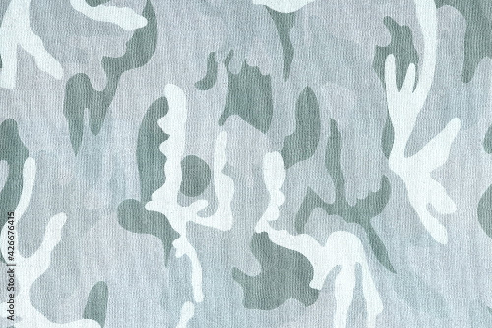 The texture of natural coarse cotton camouflage fabric.Abstract background of military fabric. The texture of natural coarse cotton camouflage fabric.Abstract background of military fabric.