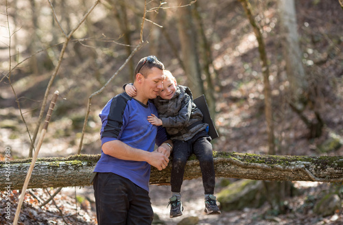 touching tender communication of the father with the son in the forest.