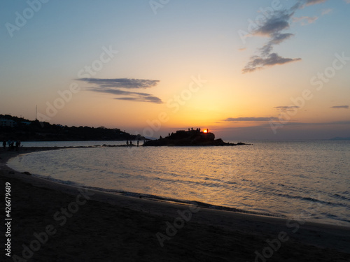 Kavouri beach with the sunset at background