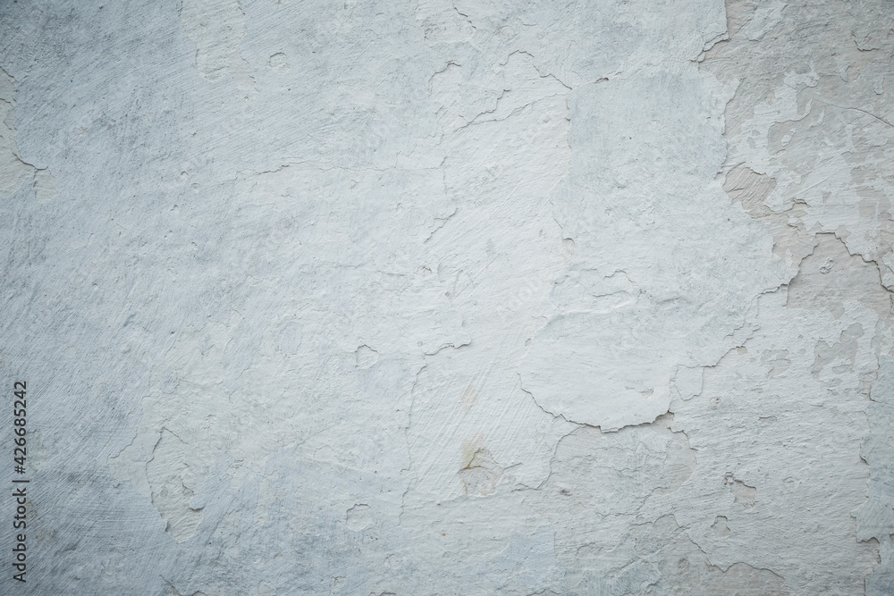 Fototapeta premium White grey old wall with shabby damaged plaster.