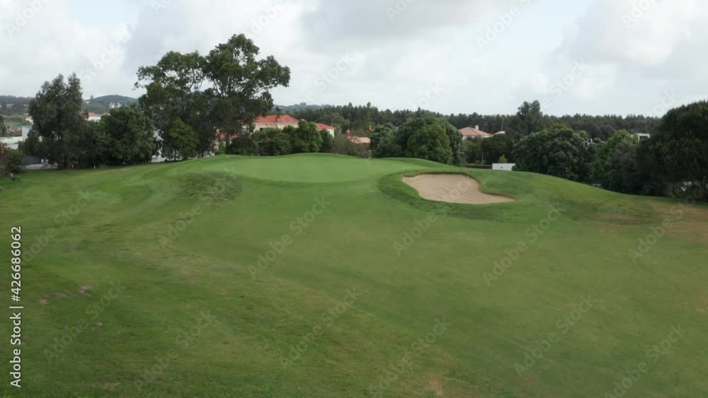 Green and Lush Landscape of Golf Course In Portugal - aerial shot Green and Lush Landscape of Golf Course In Portugal - aerial shot