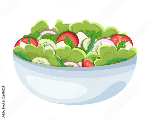Homemade salad with healthy fresh vegetables: tomatoes, cucumbers, lettuce, onions, feta