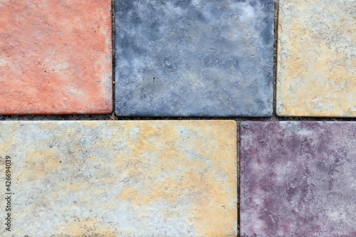 Cobblestone Pavers abstract mosaic background. Colored cobble stone texture. Close-up of street pavement
