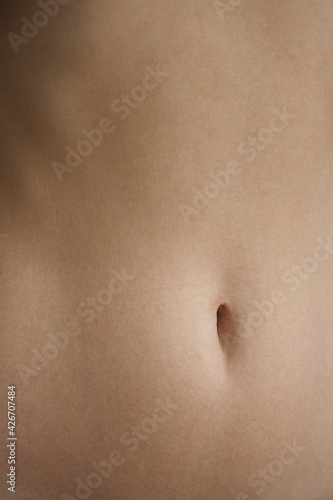 Close up young woman belly. 