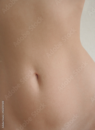 Close up young woman belly.  © Alexandra