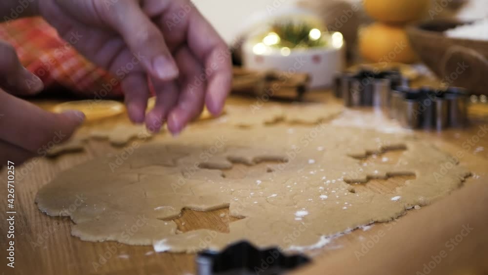 Woman cuts out christmas cookies in the form of men and stars 4K Woman cuts out christmas cookies in the form of men and stars 4K