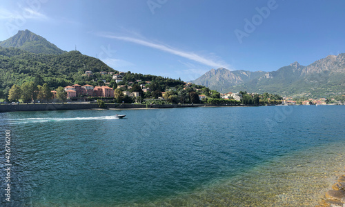 Beautiful landscape, panoramic view of mountain and lake Como in Lecco city, Italy, blue water and clear sky background