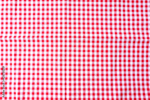 Dining table cloth texture, checkered table, red, white pattern for background, backdrop. Used for cover dining table in kitchen room.