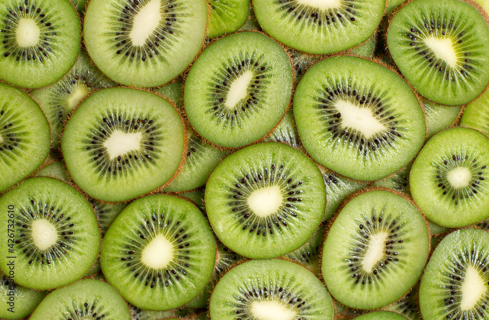 A lot of sliced Kiwi. Ripe Tropical fruits A lot of sliced Kiwi. Ripe Tropical fruits