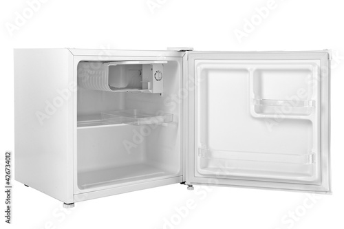 Small empty white hotel fridge open, isolated on white background