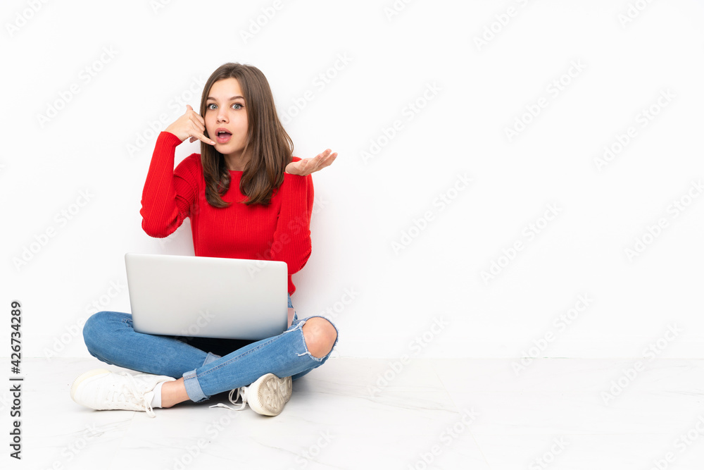 Tenaager girl working with pc isolated on white background making phone gesture and doubting Tenaager girl working with pc isolated on white background making phone gesture and doubting