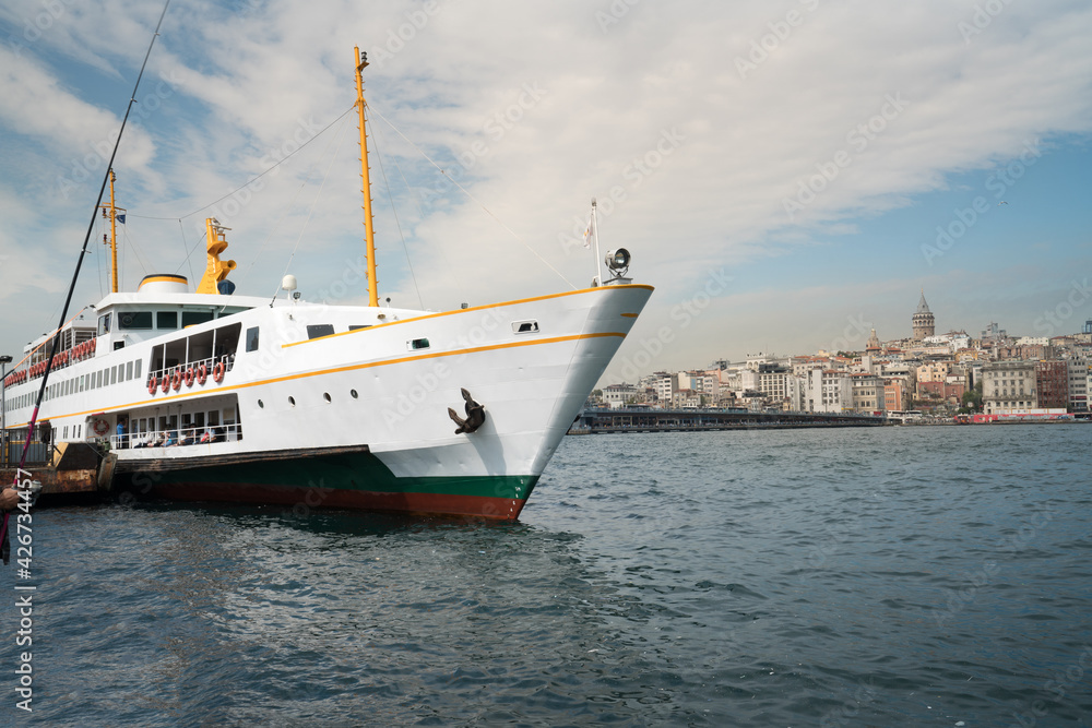 Istanbul Eminönü pier and city lines passenger ship, historical Galata tower in the background. Turkey Istanbul Eminönü pier and city lines passenger ship, historical Galata tower in the background. Turkey