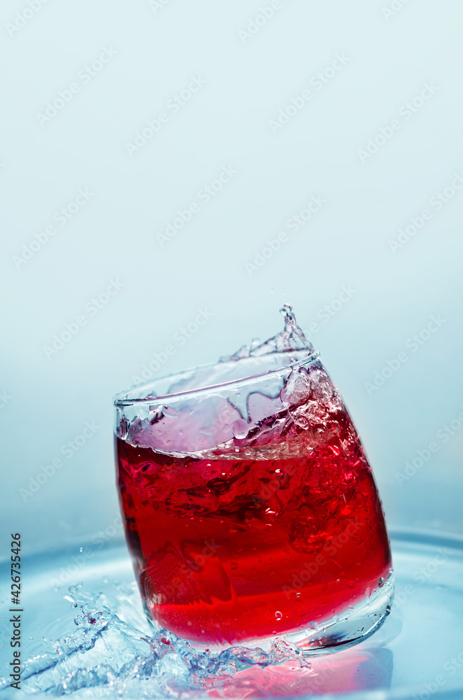 Soft drink with a splash, in the summer heat. Selective focus Soft drink with a splash, in the summer heat. Selective focus