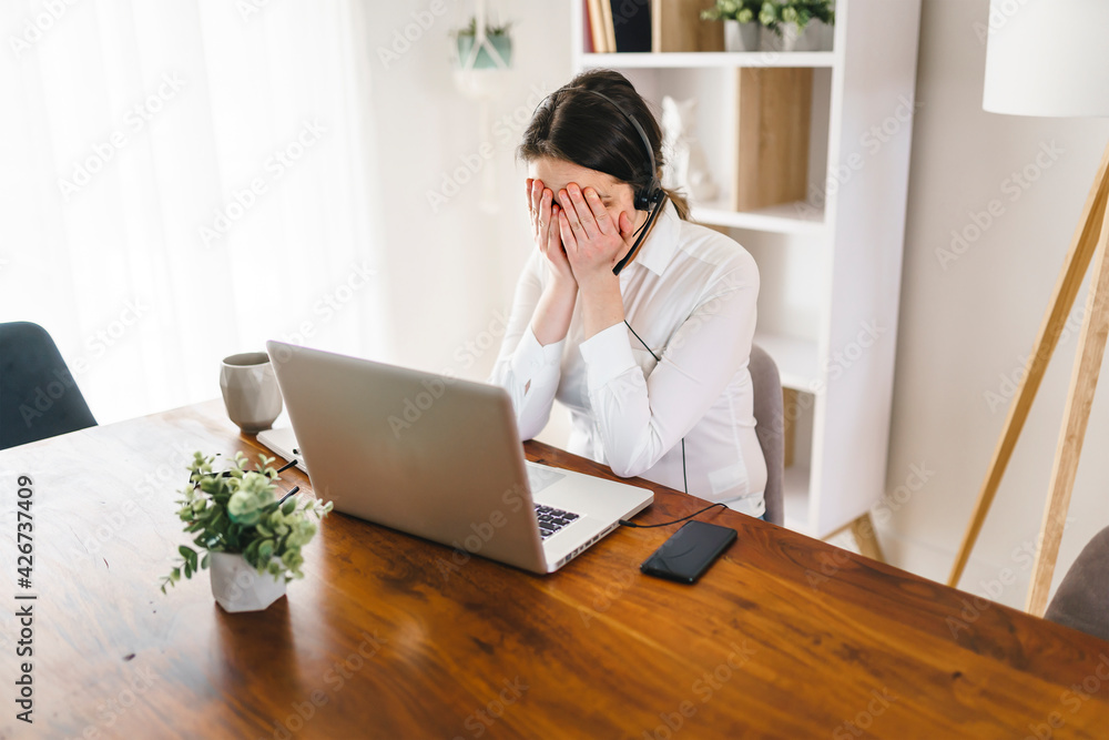 frustrated and sad woman working on laptop at home frustrated and sad woman working on laptop at home