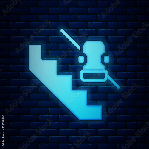 Glowing neon Disabled access elevator lift escalator icon isolated on brick wall background. Movable mechanical chair platform for handicapped human. Vector