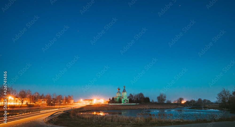 Old Russian Wooden Orthodox Church Of The Holy Trinity Under Night Starry Sky In Village Krupets, Dobrush District, Gomel Region, Belarus. Historical Heritage. Panorama, Panoramic View