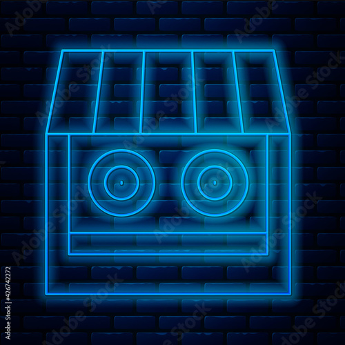 Glowing neon line Shooting gallery icon isolated on brick wall background. Shooting range. Vector