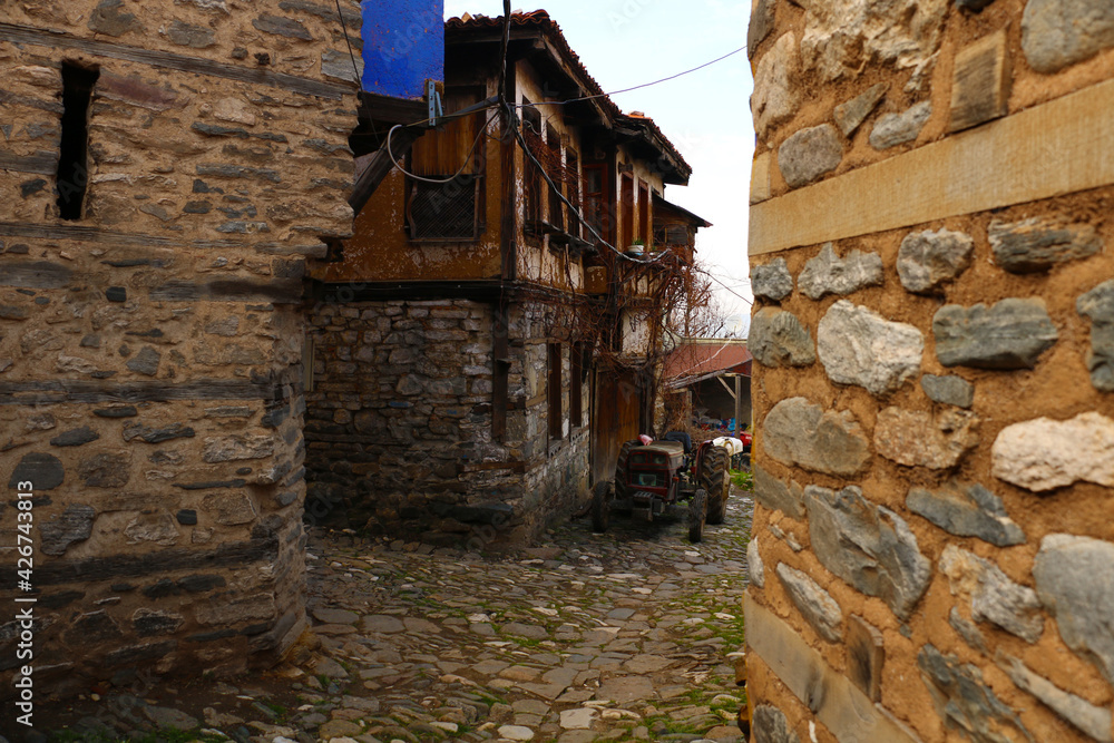 selective focus. old tractors and old village houses in Bursa in Turkey's history has been abandoned. selective focus. old tractors and old village houses in Bursa in Turkey's history has been abandoned.
