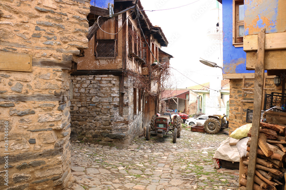 selective focus. old tractors and old village houses in Bursa in Turkey's history has been abandoned. selective focus. old tractors and old village houses in Bursa in Turkey's history has been abandoned.