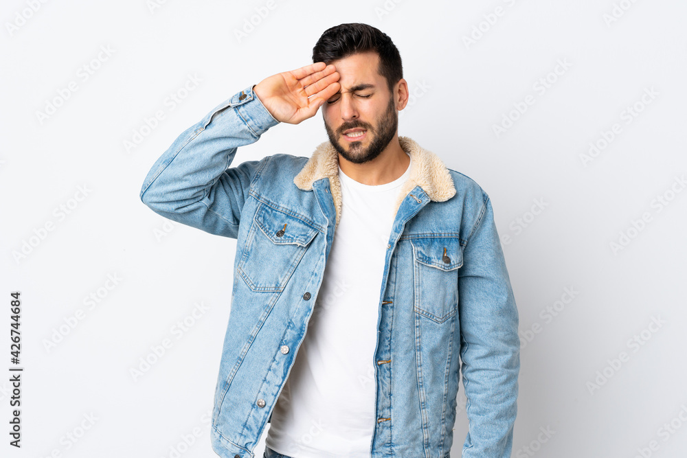 Young handsome man with beard isolated on white background with tired and sick expression Young handsome man with beard isolated on white background with tired and sick expression