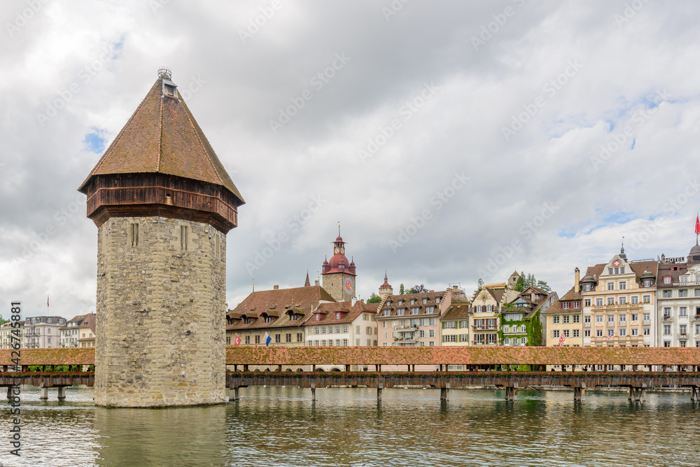 Naklejka premium Chapel bridge is located on Lucerne historical city center, it's the famous and symbol of Switzerland's main tourist attractions.
