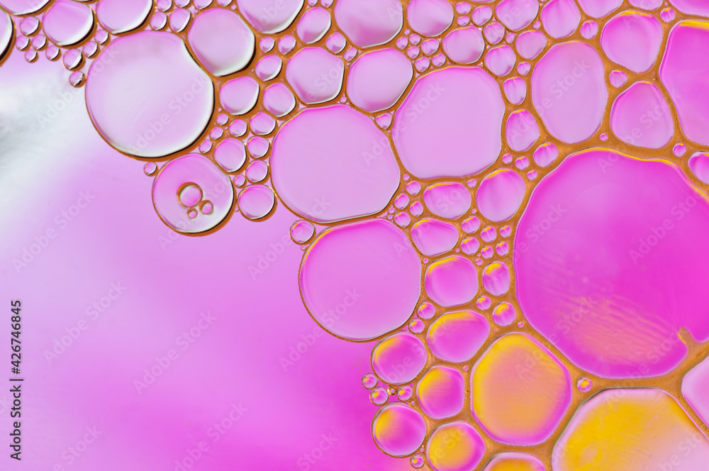 Beautiful abstract background of mixed water and oil in pink with yellow color Beautiful abstract background of mixed water and oil in pink with yellow color