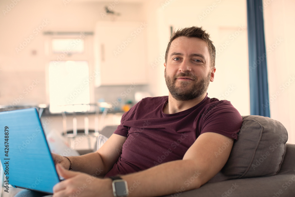 Portrait confident man working from home at laptop Portrait confident man working from home at laptop