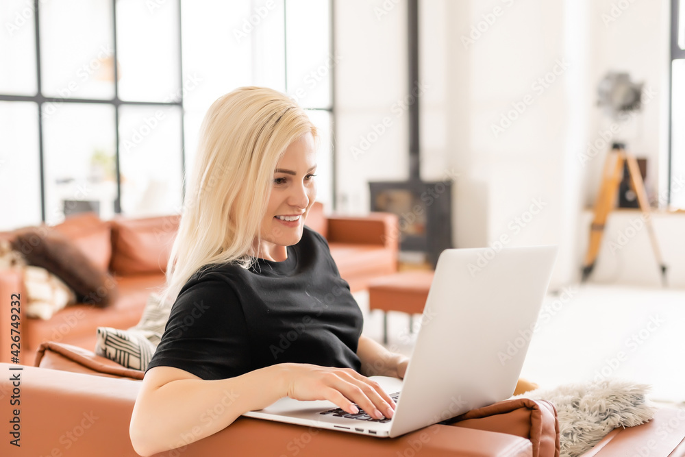young beautiful woman using a laptop computer at home young beautiful woman using a laptop computer at home