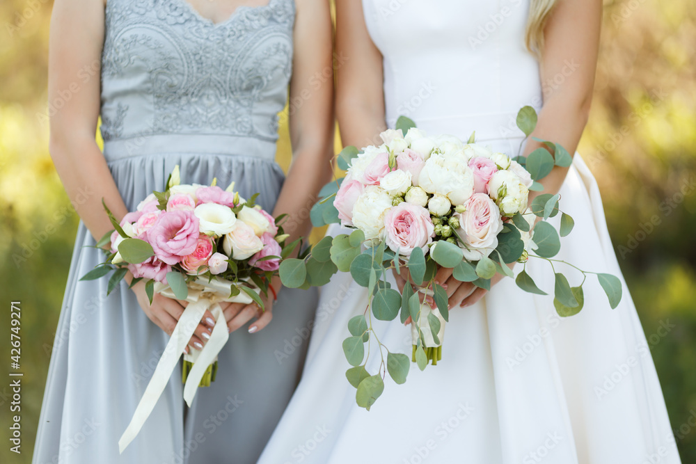 the bride holds the bouquet of flowers in her hand, the wedding floral bouquet the bride holds the bouquet of flowers in her hand, the wedding floral bouquet