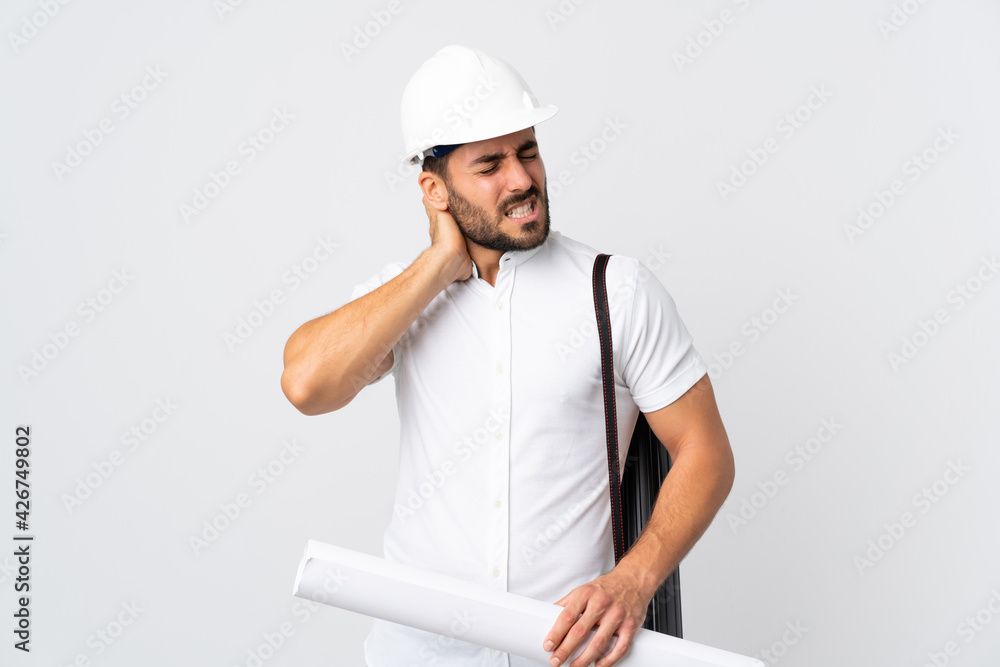 Young architect man with helmet and holding blueprints isolated on white background with neckache Young architect man with helmet and holding blueprints isolated on white background with neckache