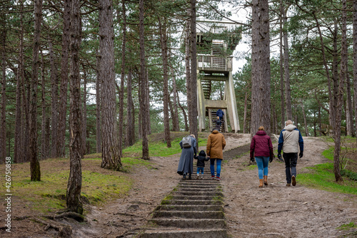 Tourists approaching observation tower on the dutch island of Texel