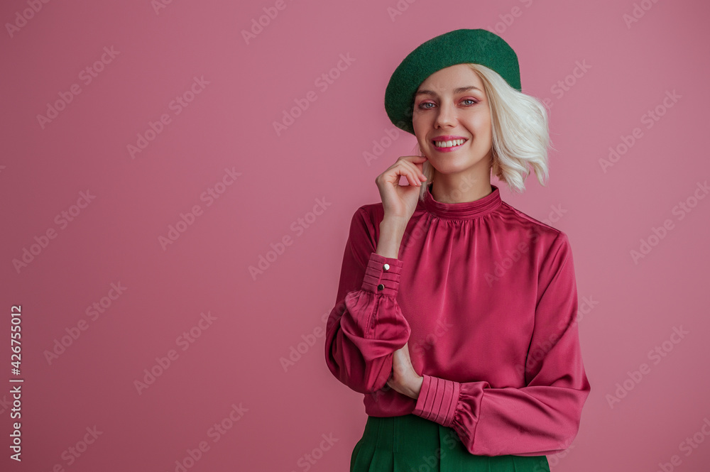 Happy smiling elegant lady wearing stylish green beret, satin blouse,  posing on pink background. Copy, empty space for text Stock Photo | Adobe  Stock