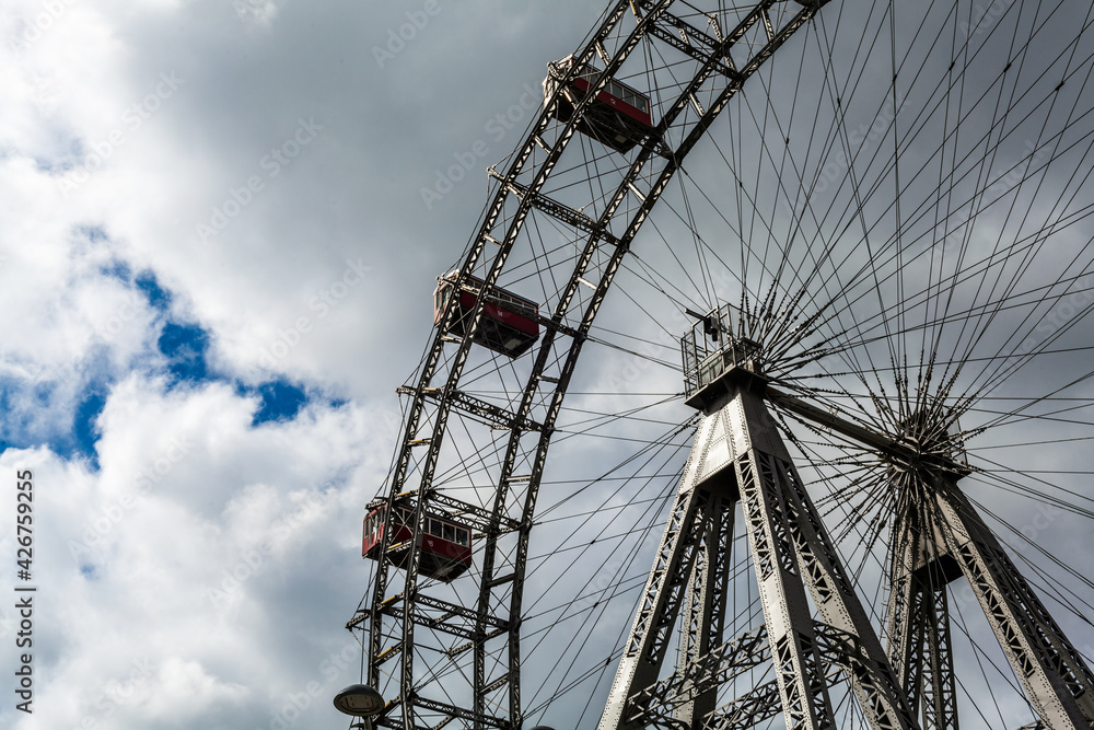 Ferris wheel in an amusement park.Blue sky. Copy space