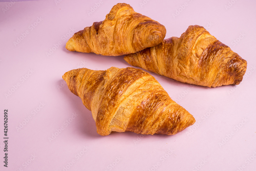 Continental breakfast with gold french croissants fruits and cup of tea Continental breakfast with gold french croissants fruits and cup of tea