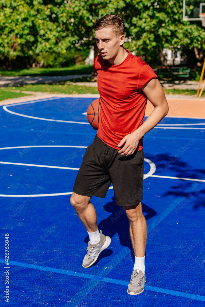 Basketball player jump shooting and playing basketball.