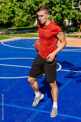 Basketball player jump shooting and playing basketball.