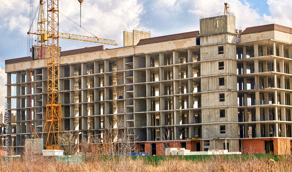 Construction of a multi-storey building in a vacant lot. Housing construction. Construction of a multi-storey building in a vacant lot. Housing construction.
