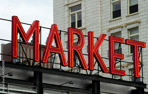 Neon Market sign in downtown city © Eric Skadson