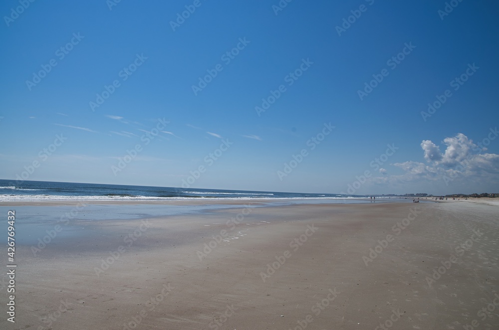 People relaxing on the beautiful beaches with white sand in Florida People relaxing on the beautiful beaches with white sand in Florida
