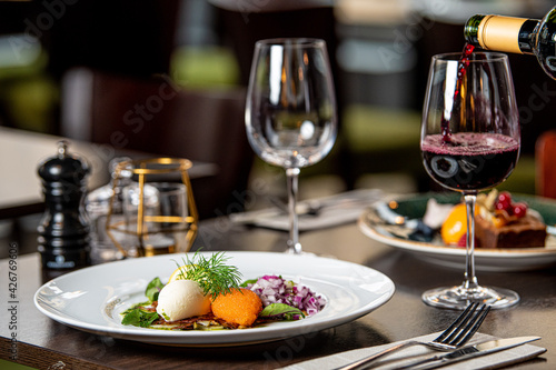 Canvastavla Lojrom (Whitefish roe) Swedish dish served at the restaurant with wine